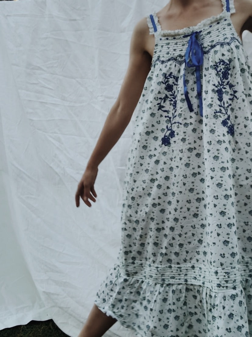 100% RECYCLED COTTON - NIGHTINGALE HAND SMOCKED MIDI DRESS BLUE ROSE FLORAL